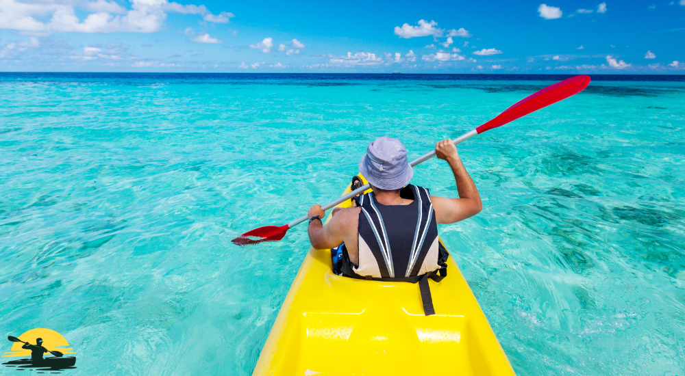 A man is kayaking into the sea 