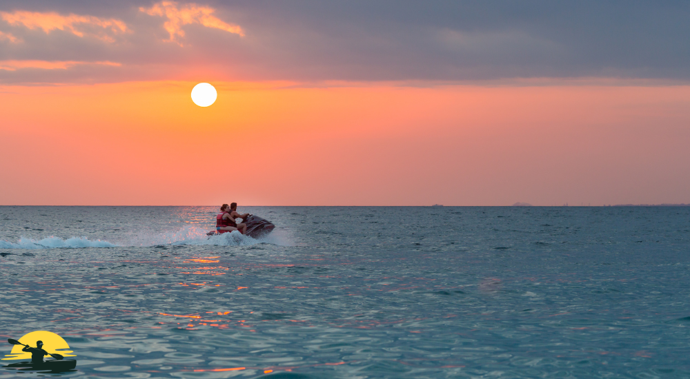a man is driving a jet ski in the sea