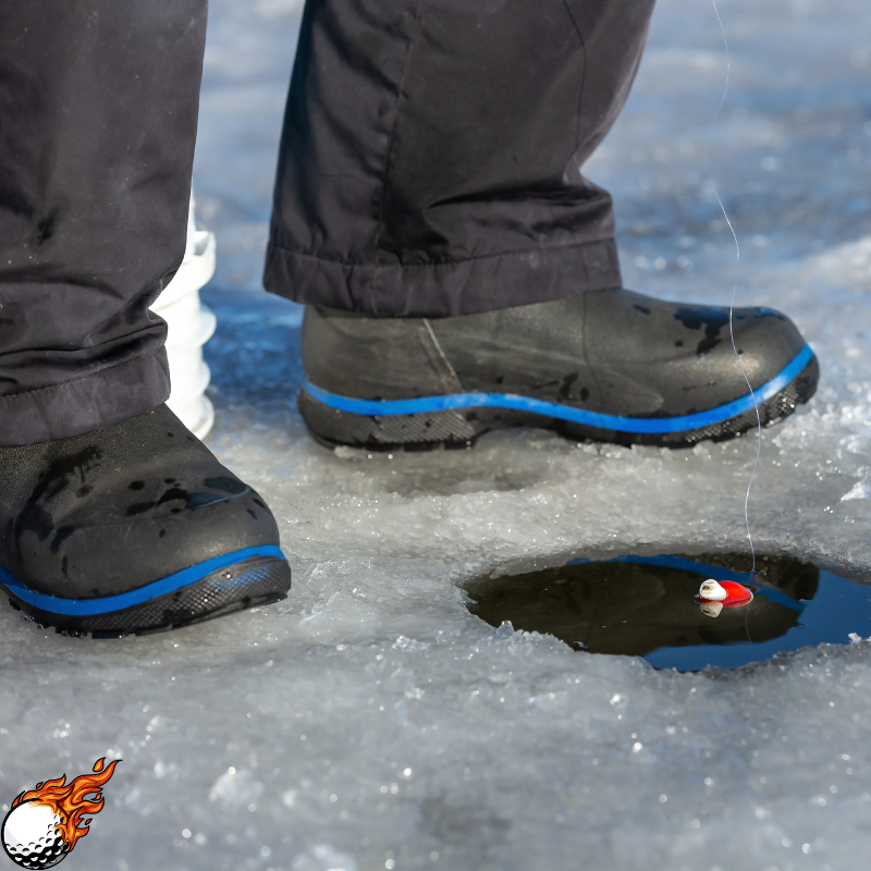 A man is wearing ice fishing boots and fishing