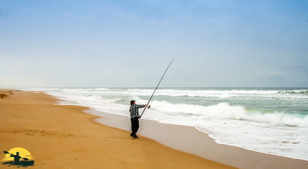 A man is casting a fishing rod in ocean