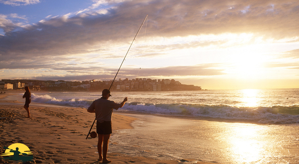 A man is fishing on the beach side