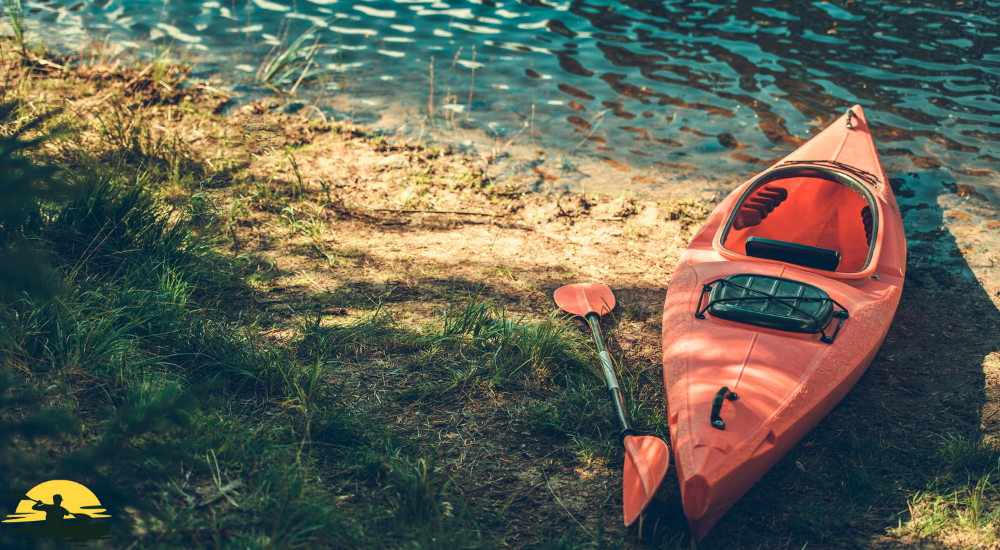 A kayak besides a lake