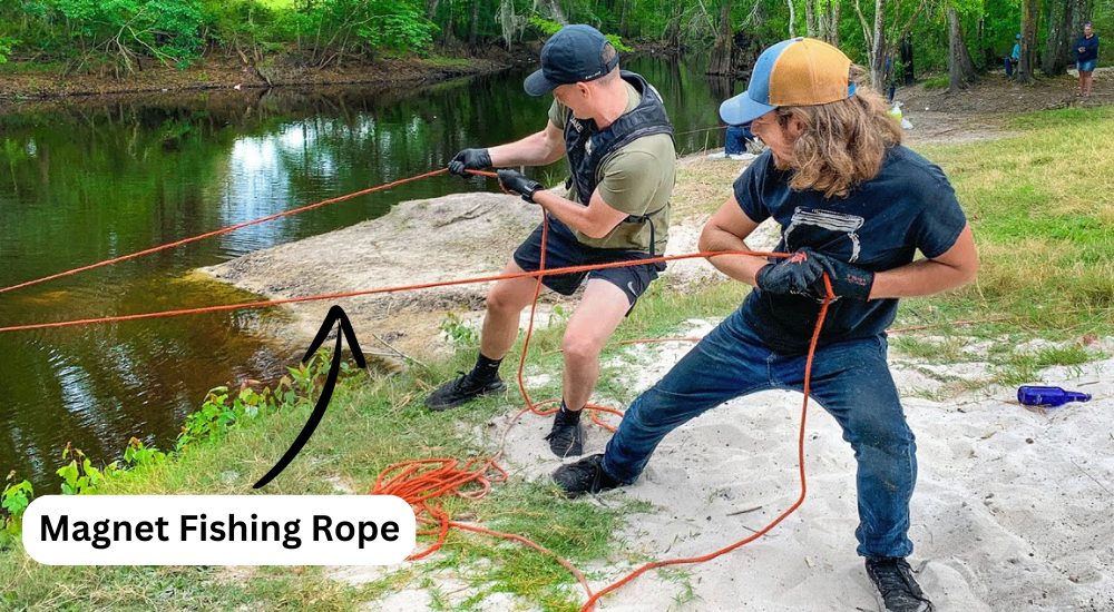 Two men are pulling rope from lake