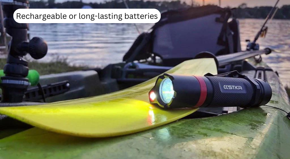 kayak paddle and flashlight