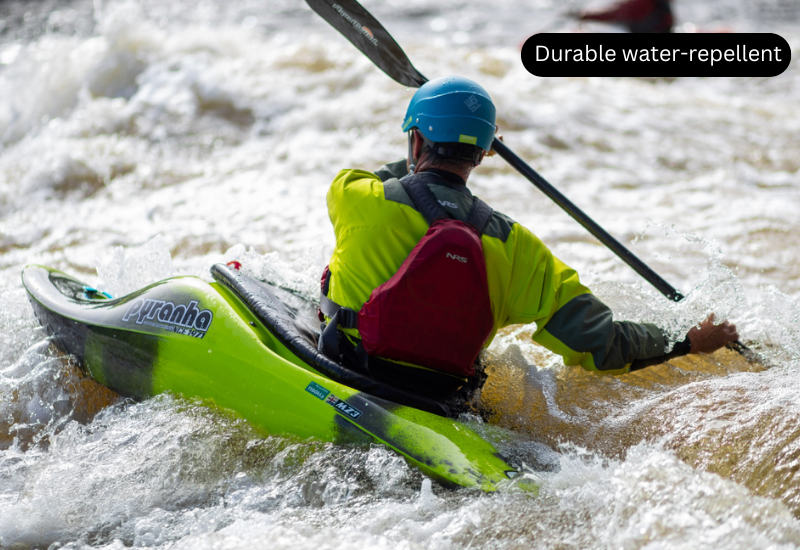 A man is kayaking on waves