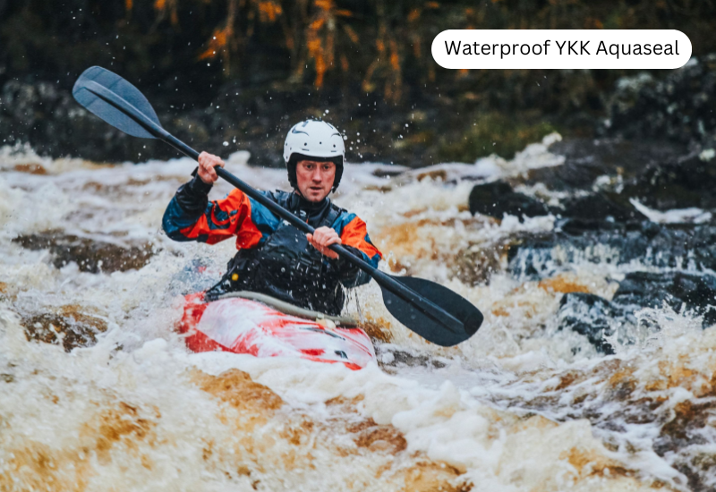 A man is kayaking on waves