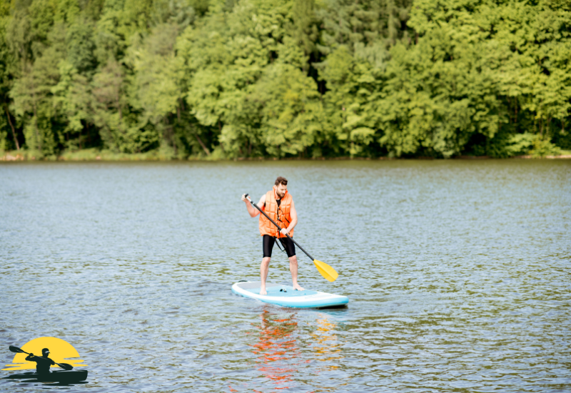 Holding a Paddle Board Paddle