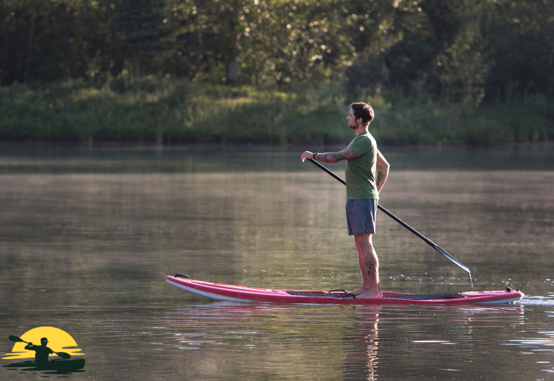 Holding a Paddle Board Paddle