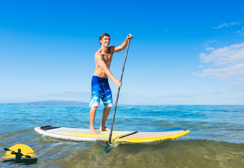 A man Standing on a Paddle Board