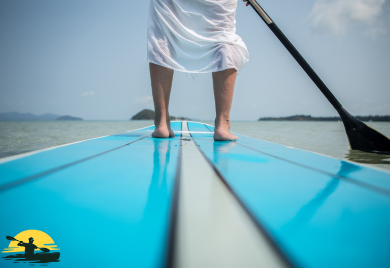 A man Standing on a Paddle Board