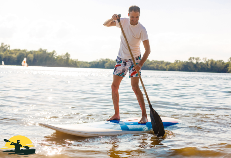 A man Standing on a Paddle Board