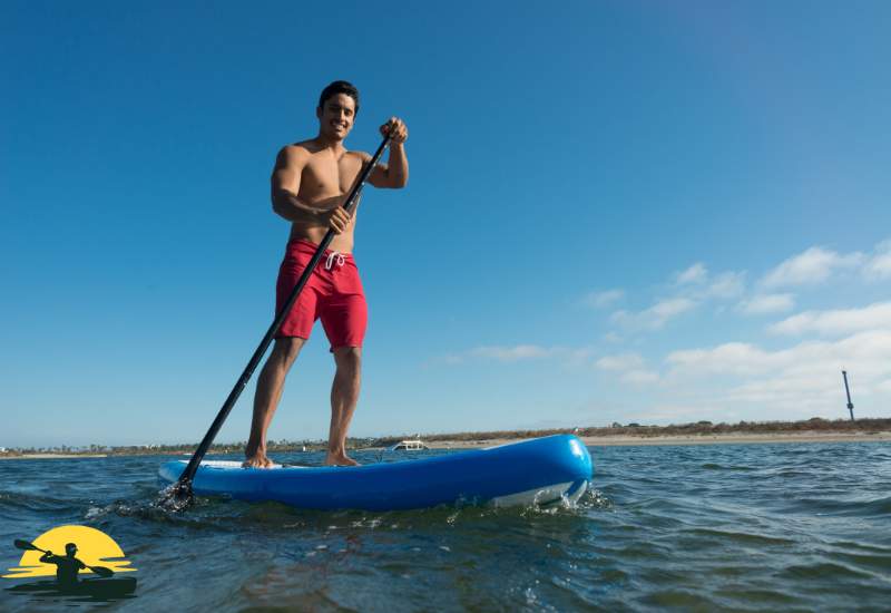 A man Standing on a Paddle Board