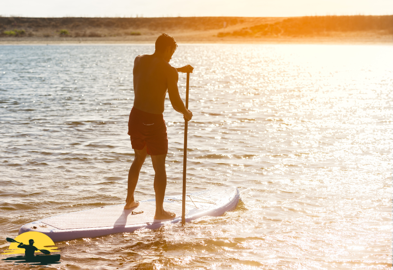 A man Standing on a Paddle Board