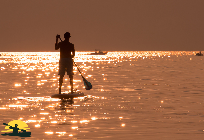 A man Standing on a Paddle Board