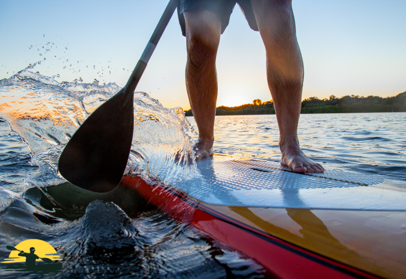 A man Standing on a Paddle Board