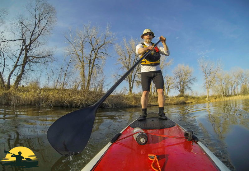 A man Standing on a Paddle Board