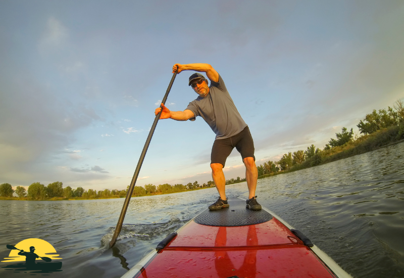 A man Standing on a Paddle Board